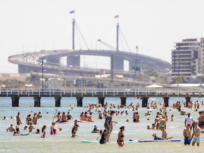 People cooled off in the water at South Melbourne. Picture: Ian Currie