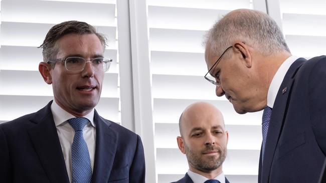 NSW Premier Dominic Perrottet, left, with Scott Morrison, right, on Tuesday. Picture: Jason Edwards