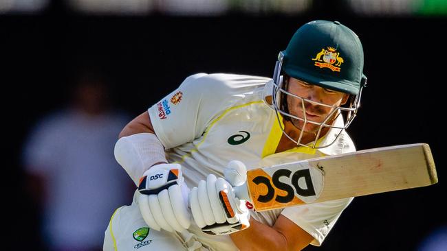 Australia's David Warner ducks under a rising delivery in the Brisbane Test.