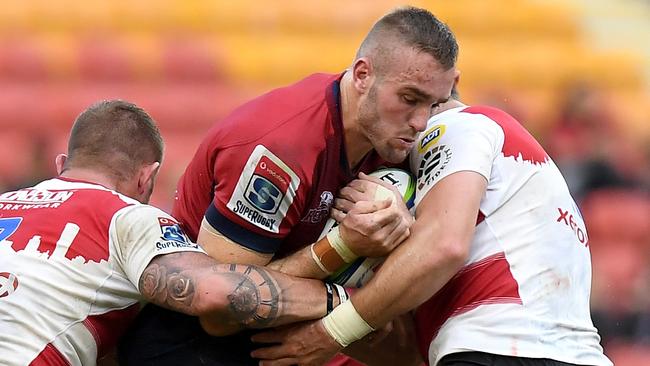 BRISBANE, AUSTRALIA - APRIL 28:  Izack Rodda of the Reds takes on the defence during the round 11 Super Rugby match between the Queensland Reds and the Lions at Suncorp Stadium on April 28, 2018 in Brisbane, Australia.  (Photo by Bradley Kanaris/Getty Images)