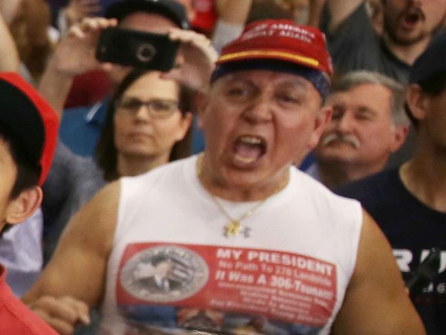 MELBOURNE, FL - OCTOBER 26: In this file picture from 2017, Cesar Sayoc (far right in red hat) is seen as President Donald Trump speaks during a campaign rally at the AeroMod International hangar at Orlando Melbourne International Airport on February 18, 2017 in Melbourne, Florida. Mr. Sayoc was arrested on allegations that he was the person who mailed pipe bomb devices that targeted critics of President Donald Trump and have been recovered in New York, Washington D.C., California and South Florida, all with the return address of Debbie Wassermann-Schultz's office.   Joe Raedle/Getty Images/AFP == FOR NEWSPAPERS, INTERNET, TELCOS & TELEVISION USE ONLY ==