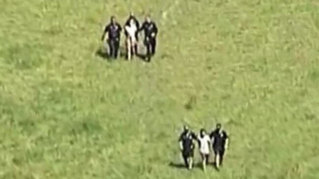 Teenagers are led away by police after being arrested in Pimpama on Wednesday following a two-hour chase. Picture: 7 News Gold Coast