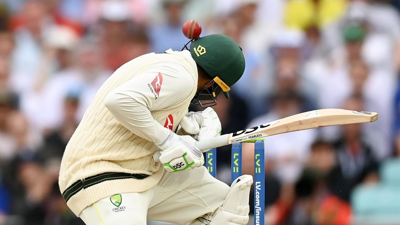 Usman Khawaja is hit on the helmet by a Mark Wood delivery. (Photo by Gareth Copley/Getty Images)