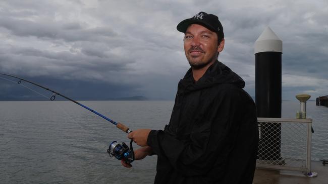 Chilean visitor to Port Douglas Pablo Rigo-Righi wets a line ahead of the arrival of Cyclone Jasper. Picture: Peter Carruthers