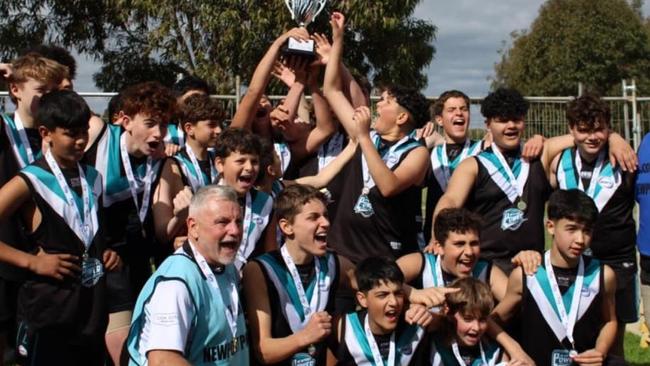 Sean Adams celebrating the 2023 Under 14s premiership win with Newport Power.