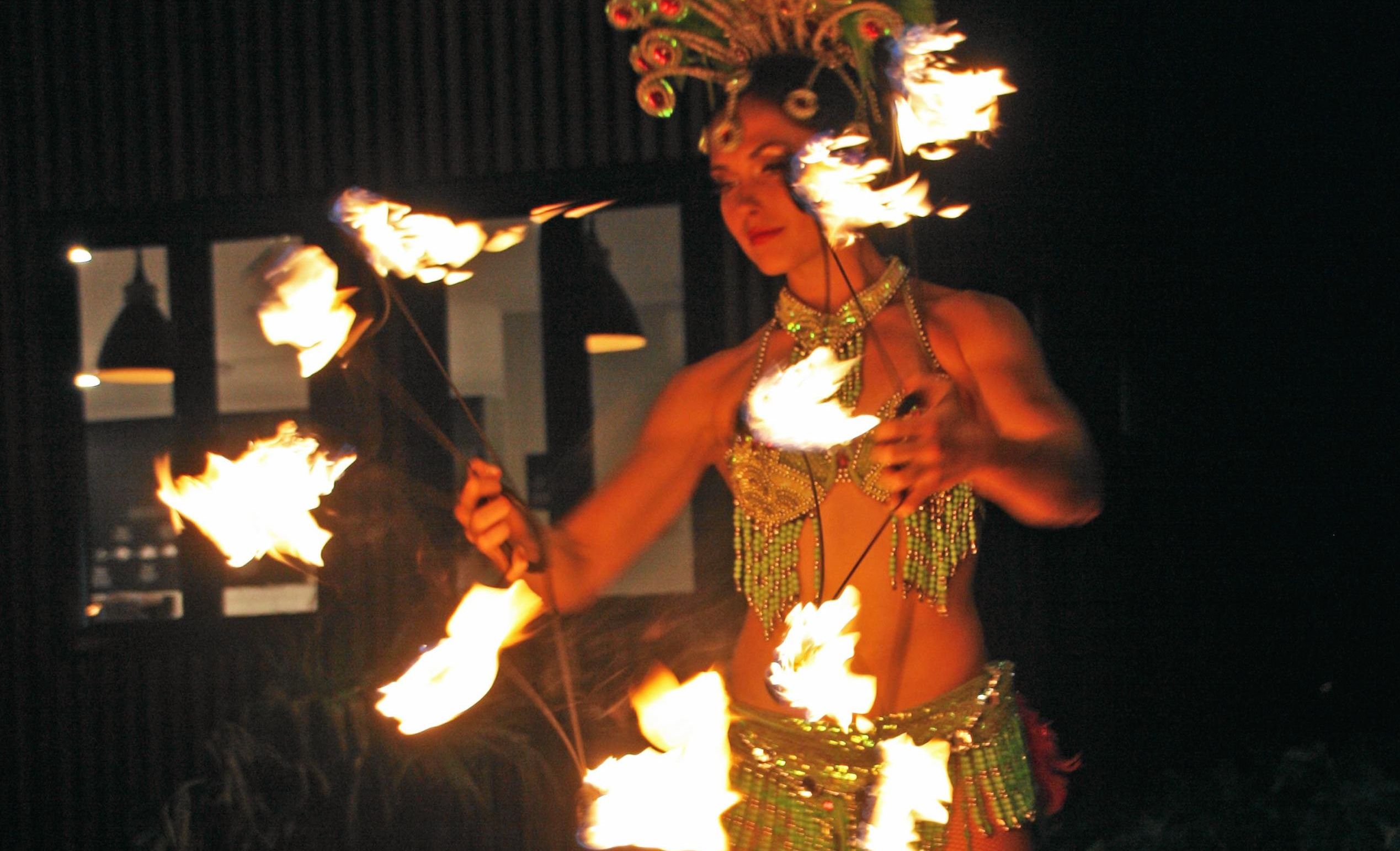 Fire dancer Sasha at AVID Property Group's launch of its new sales and information centre in Palmview's master-planned community of Harmony. Picture: Erle Levey