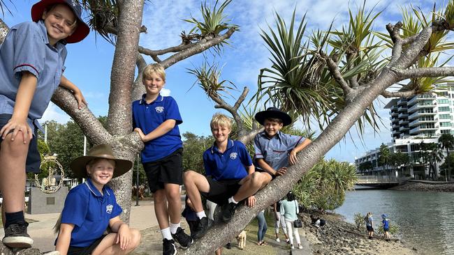 Stella Maris Catholic Primary School and Mooloolaba State School students Reid Hutton, Ruby Hamer, Finn Pearson, Harley Pearson and Knox Hutton following the Anzac Day parade in Maroochydore.