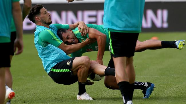 Mathew Leckie tangles with Andrew Nabbout at training. Picture: Toby Zerna