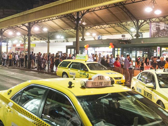 Friday Night in the City. Melbournians out and about in the CBD on the last Friday night before Christmas. 1:40 The taxi rank at Flinders Street Station in full swing. Picture: Eugene Hyland