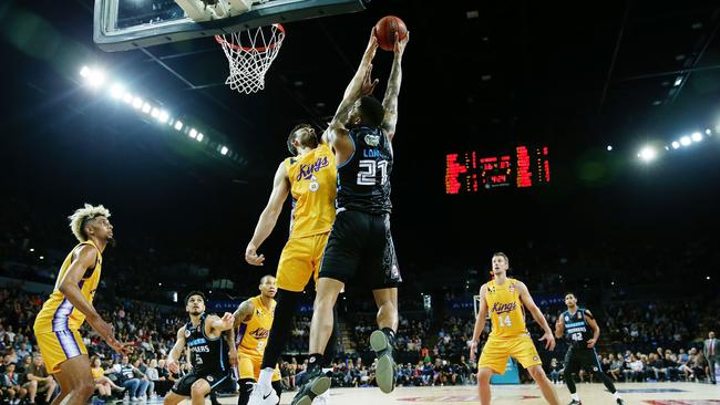 Andrew Bogut with a monster block on Shawn Long. Picture: Getty