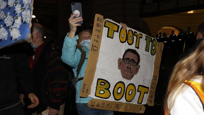 Protesters carry signs on their march. Picture: MatrixNews