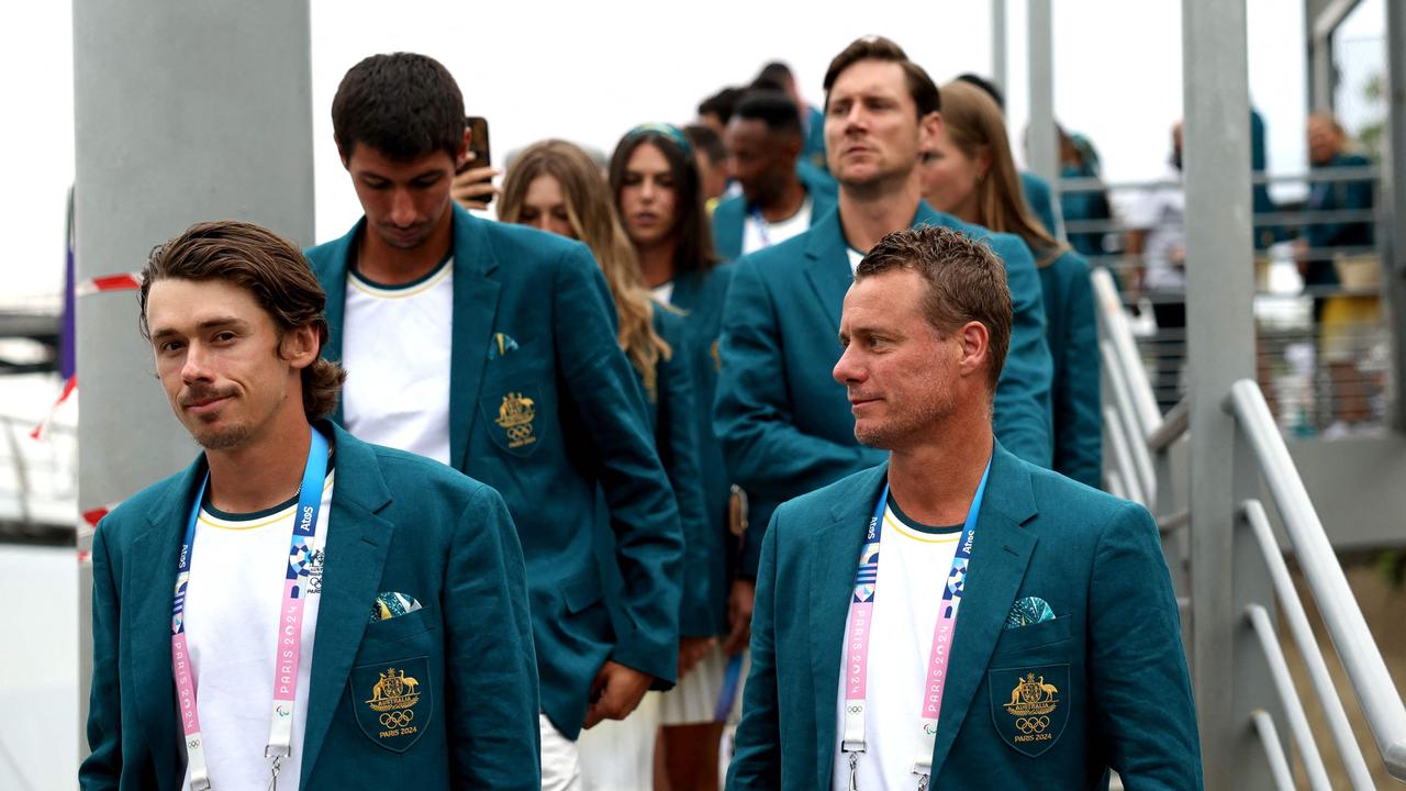 PARIS, FRANCE - JULY 26: Athletes of Team Australia Alex De Minaur and Lleyton Hewitt arrive on the team boat during the opening ceremony of the Olympic Games Paris 2024 on July 26, 2024 in Paris, France. (Photo by Quinn Rooney / POOL / AFP)