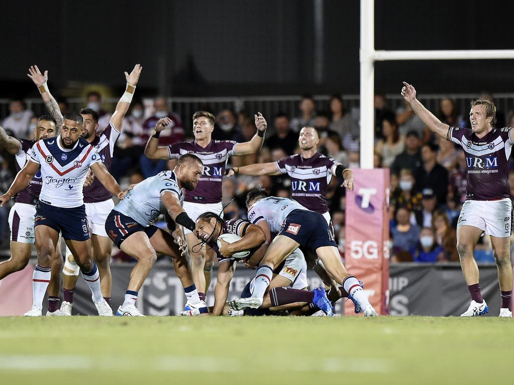 Martin Taupau of the Sea Eagles is tackled during the NRL Semi-Final match between the Manly Sea Eagles and the Sydney Roosters at BB Print Stadium on September 17, 2021 in Mackay, Australia. Picture: Matt Roberts