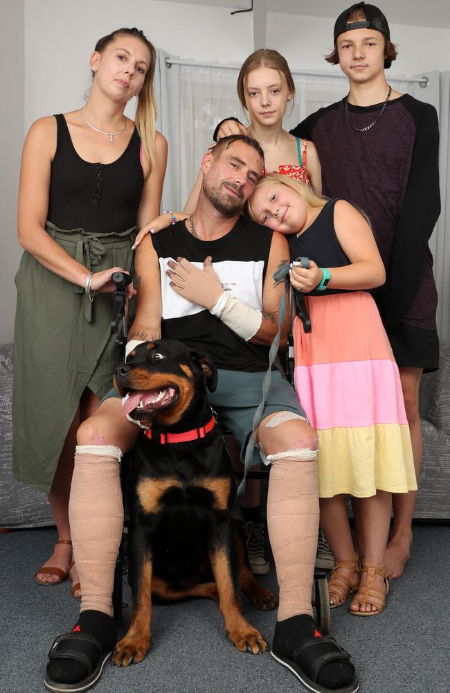 Troy Pauling and partner Jessica Gravener with their children Kesha, 7, Kayla 16, Riley, 13, and their only surviving dog Lily. Picture: Jonathan Ng