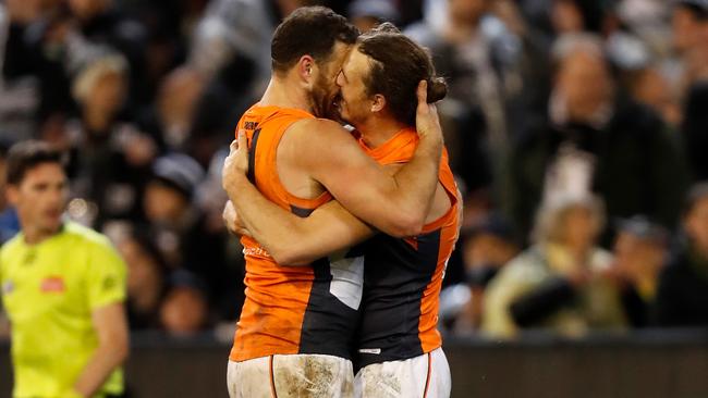 MELBOURNE, AUSTRALIA – SEPTEMBER 21: Shane Mumford of the Giants (left) and Phil Davis of the Giants celebrate as the final siren sounds during the 2019 AFL First Preliminary Final match between the Collingwood Magpies and the GWS Giants at the Melbourne Cricket Ground on September 21, 2019 in Melbourne, Australia. (Photo by Michael Willson/AFL Photos via Getty Images)