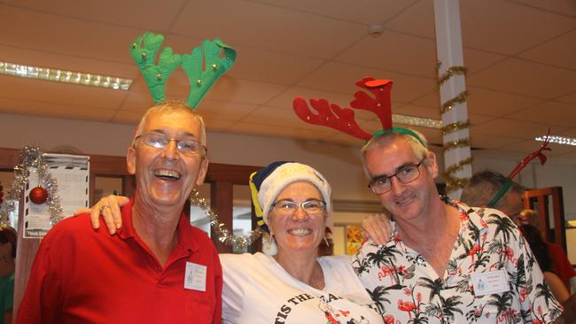 Sharing the love and delicious meals were volunteers Keith Seaton, Kath Johnson and Ken Foran at the 2022 Cairns Community Christmas Lunch. Picture: Alison Paterson