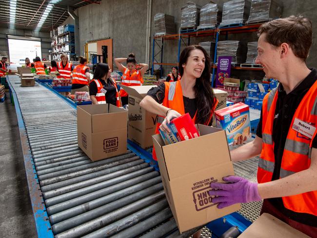 Volunteers at the Yarraville warehouse will sort out food from the donation. Picture: Jay Town