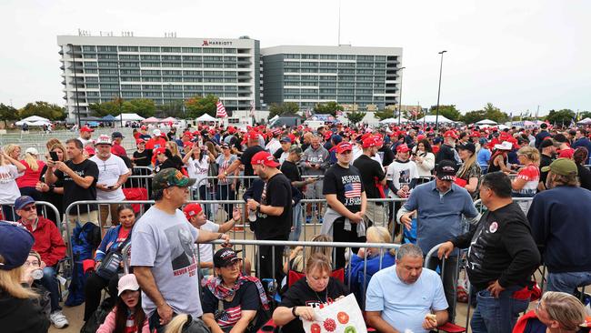 Supporters of Donald Trump wait for the start of his campaign rally at Nassau Veterans Memorial Coliseum. Picture: AFP