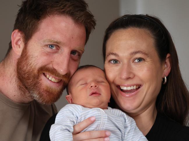 Former AFL player Reece Conca welcoming IVF miracle baby boy last week and talking about male infertility. Reece Conca with his partner Annabelle Grace and one week old baby boy Giovanni at home.                                                               Picture: David Caird