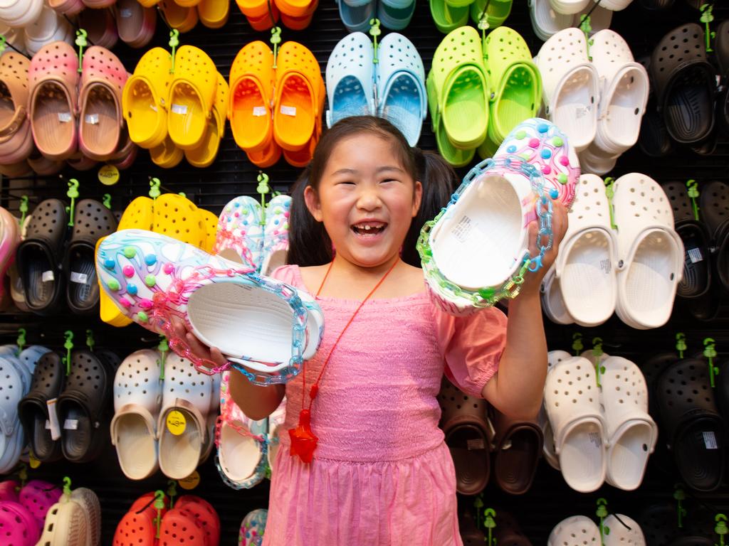 Yiyi Zhang, 7, tries out Crocs at the Platypus store in Rundle Mall, Adelaide. Picture: Brett Hartwig