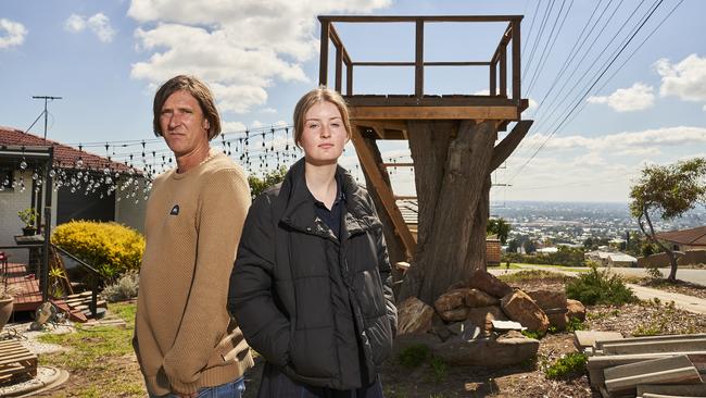 Joe Statton and stepdaughter Zenayah, 13, in front of the treehouse Marion Council says must come down. Picture: Matt Loxton