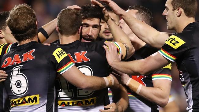 James Tamou of the Panthers celebrates with teammates after scoring a try.