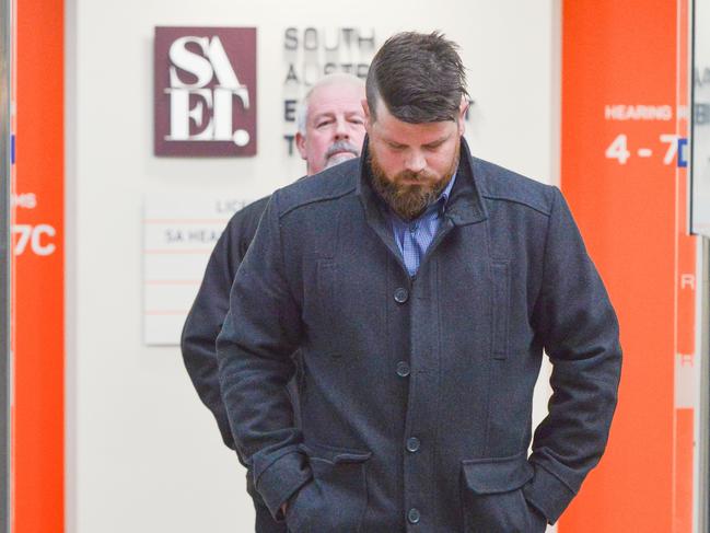 Luke Daniel Chenoweth, front, with a supporter after facing a bullying prosecution by Safework SA, Wednesday, July 17, 2019. Picture: Brenton Edwards