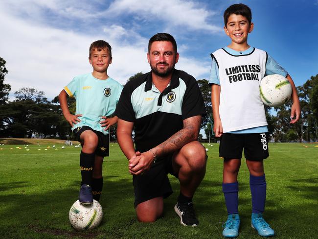 Joshua Slaby, 8, left, and Jonni Marino, 10, with former professional soccer player Alex Cisak. Picture: NIKKI DAVIS-JONES