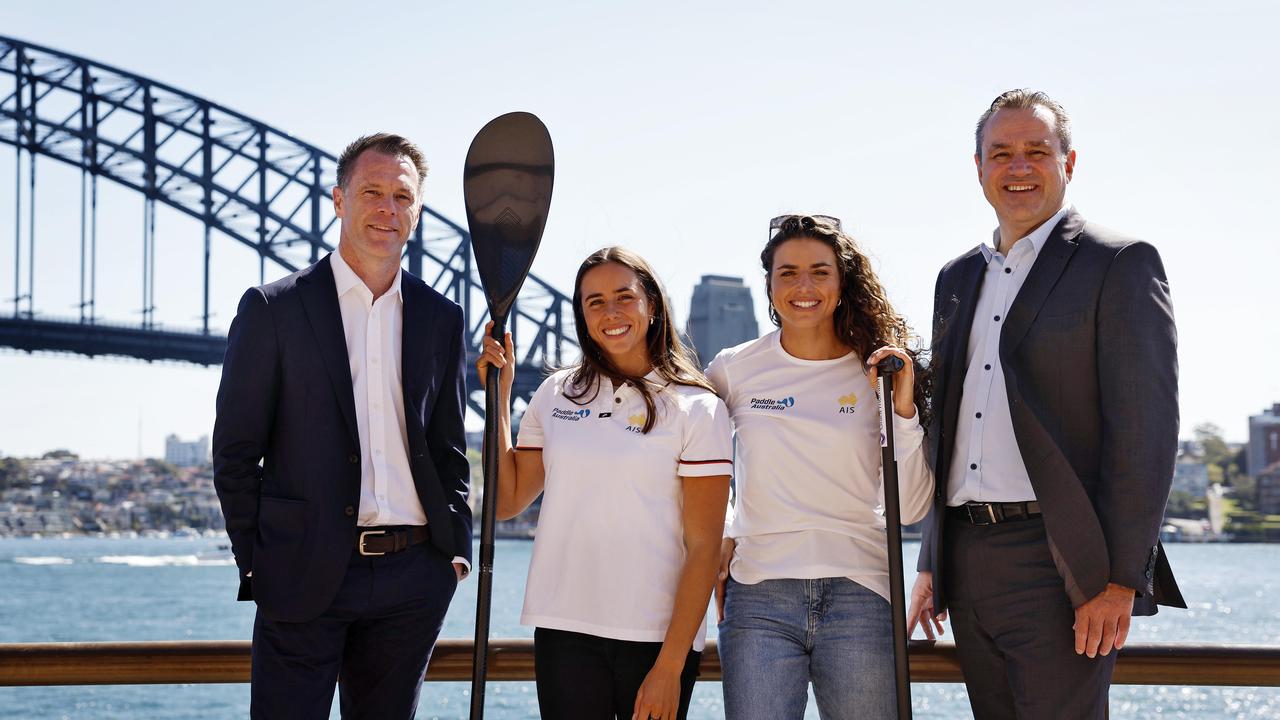 Olympic gold medallist sisters Noemie (2nd from left) and Jessica Fox stand with NSW Premier Chris Minns on left and Sports Minister Steve Kamper on right. Picture: Sam Ruttyn