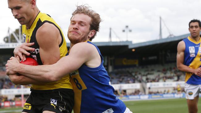 VFL Grand Final. 22/09/2019. Richmond vs Williamstown at Ikon Park, Carlton. Richmonds Daniel Butler tackled by Williamstowns Nick Mellington . Pic: Michael Klein.