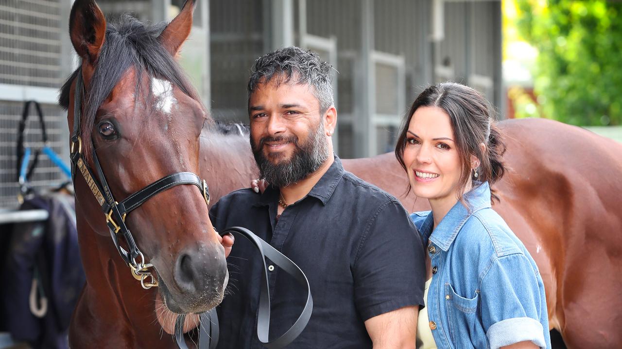 Car wash operator Rohit Saini with wife Alana and their Melbourne Cup contender Okita Soushi. Picture: Rebecca Michael