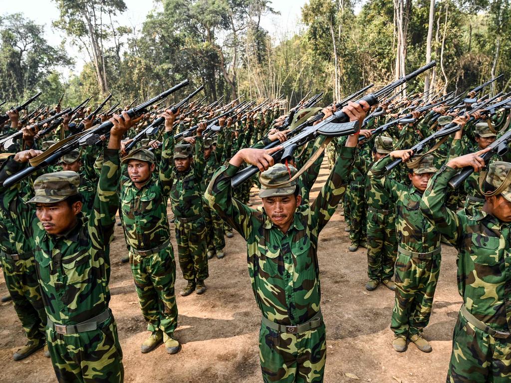 Members of the ethnic rebel group Ta'ang National Liberation Army (TNLA) take part in a training exercise at their base camp in the forest in Myanmar's northern Shan State.