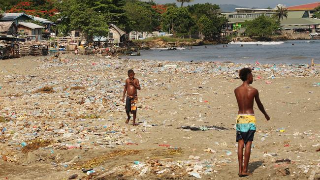 Children and families wash and swim in sewage and rubbish in Honiara. Picture: Vanessa Hunter