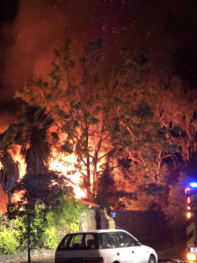 Neighbours watched burning ash spurt from the house.