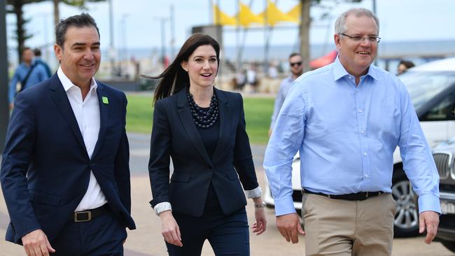 Prime Minster Scott Morrison with South Australian Premier Steven Marshall and Boothby MP Nicole Flint during a visit to the Glenelg Surf Life Saving club in the lead up to the election. Picture: AAP Image/David Mariuz