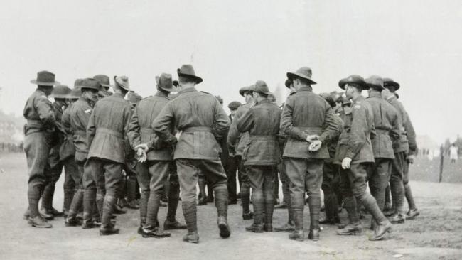 Australian soldiers play two-up at Chataley in Belgium circa 1919. Photo: Robert Otto Boese/Australian War Memorial