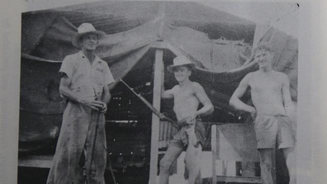 Richie Britten (centre) at the Harveys Creek camp with his father on the left and brother Les on the right. The family spent Cyclone Agnes in this hut in 1956. Picture: Supplied