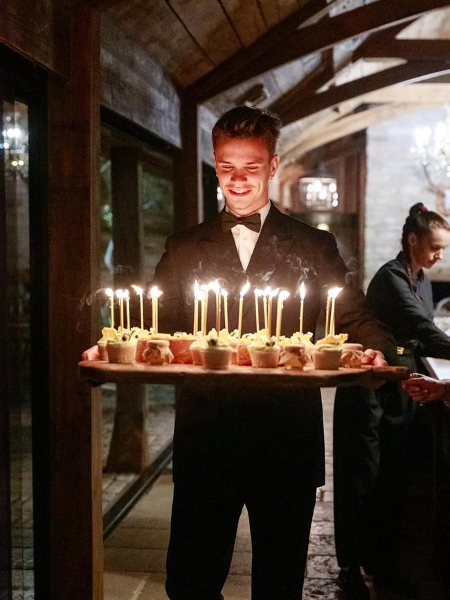 Romeo could be seen carrying plenty of individual cakes adorned with candles.
