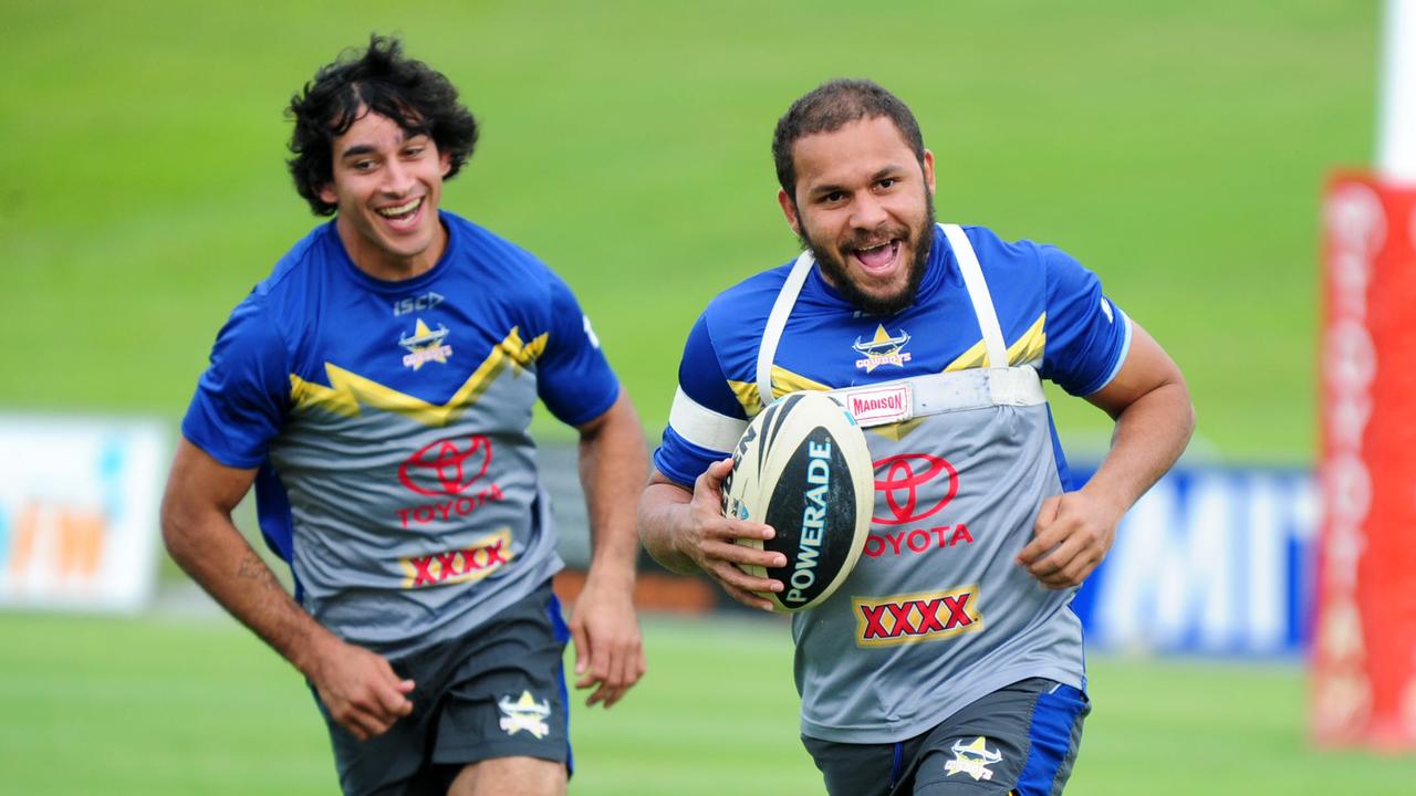 Matt Bowen chased by Johnathan Thurston at training at 1300SMILES Stadium. Picture: Scott Radford-Chisholm, May 2013