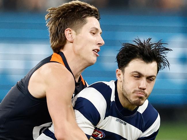 MELBOURNE, AUSTRALIA - JUNE 21: Brad Close of the Cats is tackled by Lachie Fogarty of the Blues during the 2024 AFL Round 15 match between the Carlton Blues and the Geelong Cats at The Melbourne Cricket Ground on June 21, 2024 in Melbourne, Australia. (Photo by Michael Willson/AFL Photos via Getty Images)