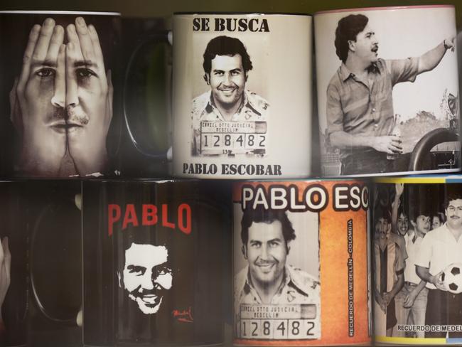 View of souvenirs with the image of the late Colombian drug lord Pablo Escobar for sale in a hairdresser's at Pablo Escobar’s old neighbourhood. Picture: AFP