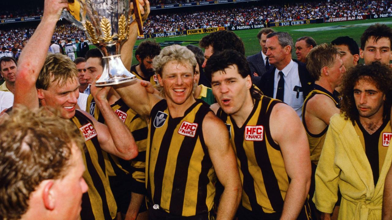 Dermott Brereton celebrates with the Premiership Cup after the 1988 AFL Grand Final.