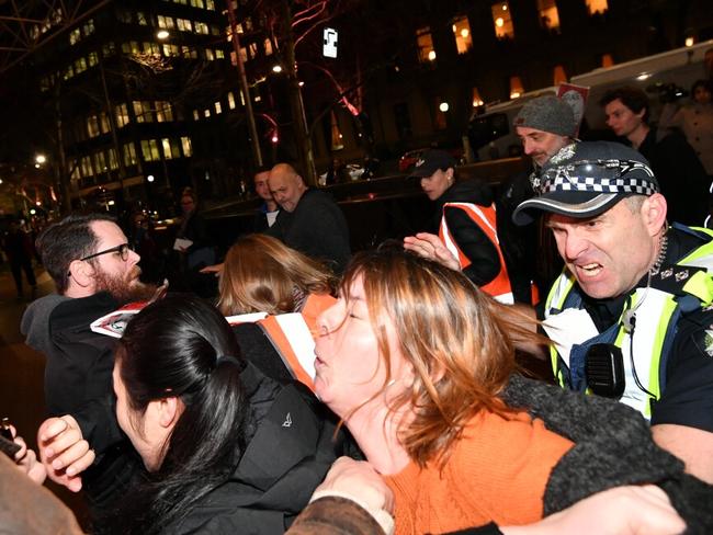 Police push back against protesters outside right-wing UK politician Nigel Farage’s speaking event. Picture: Jake Nowakowski