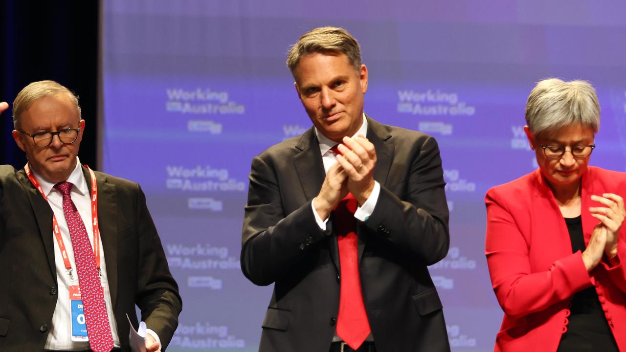 Prime Minister Anthony Albanese, Deputy Prime Minister Richard Marles and Minister for Foreign Affairs Penny Wong react after AUKUS was passed during the ALP National Conference in Brisbane. Picture: NCA NewsWire/Tertius Pickard