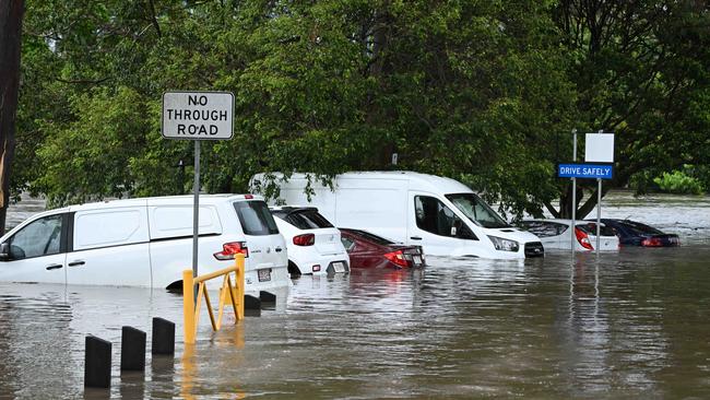 A number of vehicles inundated at Hanlon Park at Stones Corner. Picture: Lyndon Mechielsen/Courier Mail