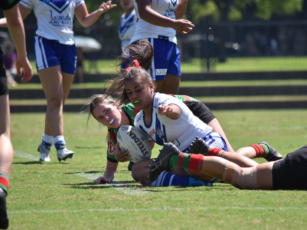 Litia Fusi is tackled by Parker Stanton. Picture: Sean Teuma/NewsLocal