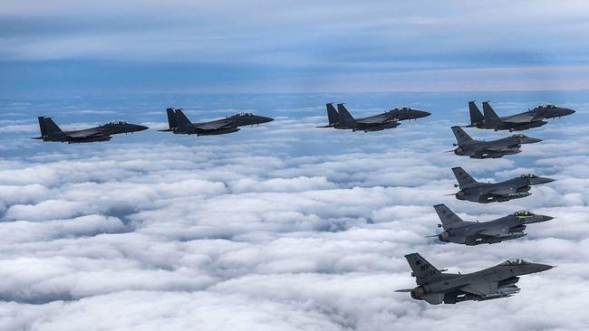 South Korean Air Force F-15Ks and US Air Force F-16 fighters flying over South Korea in response to North Korea a missile over Japan. Picture: AFP