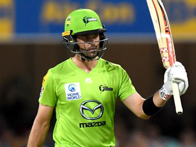 BRISBANE, AUSTRALIA - DECEMBER 17: Callum Ferguson of the Thunder celebrates scoring a half century during the Big Bash League match between the Brisbane Heat and the Sydney Thunder at The Gabba on December 17, 2019 in Brisbane, Australia. (Photo by Bradley Kanaris/Getty Images)