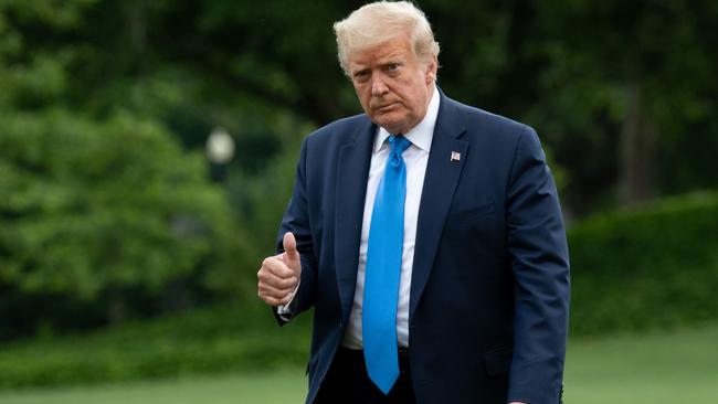 Donald Trump returns to the White House after visiting Walter Reed National Military Medical Center. Picture: AFP.