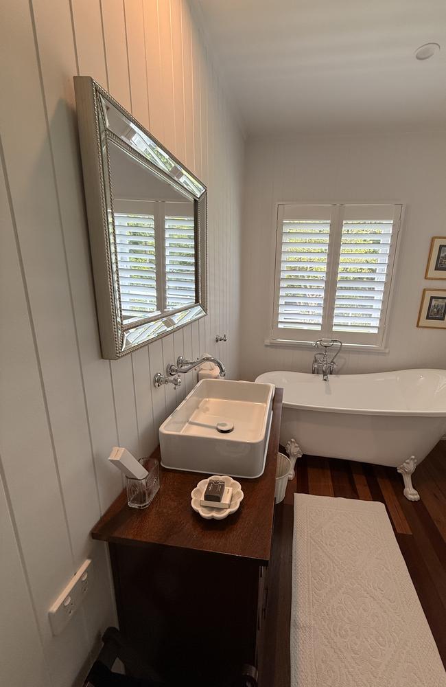 Elsie's Cottage has two bedrooms, the first with a more traditional bath in keeping with its history. Photo: Mark Furler